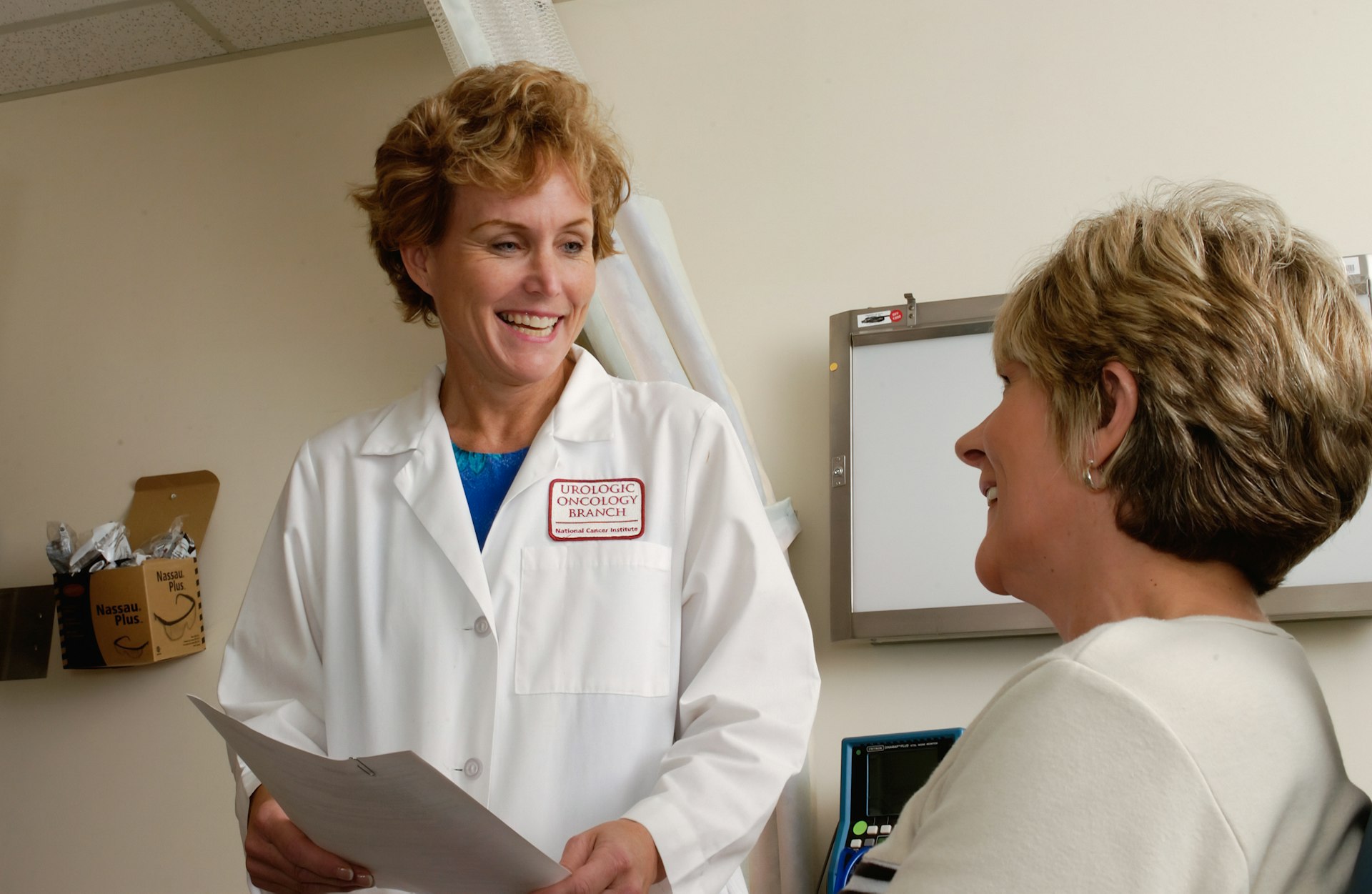 Two clinicians reviewing patient data together at a hospital workstation